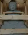 Artikelbild des Artikels “Sitzender Buddha, Japaner, 78 cm Höhe, Naturstein (Basanit), Steinmetzarbeiten. Naturstein, Grau “